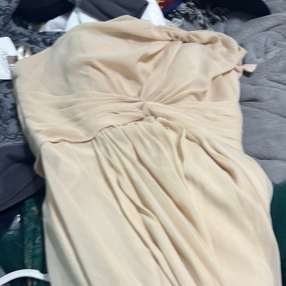 Elegant Cream Dress has no sleeves